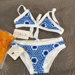 Brand new 2 piece swimsuit girls size 7.  Azul solar wave.  Still has tags.